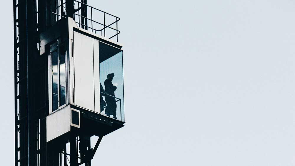 low-angle-view-elevator-structure-against-clear-sky