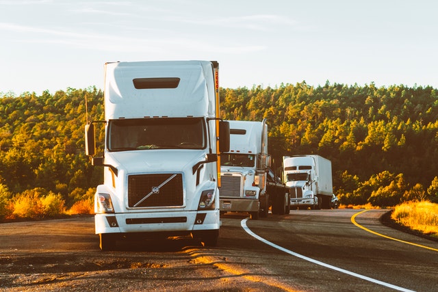 white-volvo-semi-truck-on-side-of-road-2199293